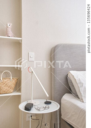 Minimalist bedroom with modern lamp and nightstand Minimalist bedroom with modern lamp and nightstand 135696424