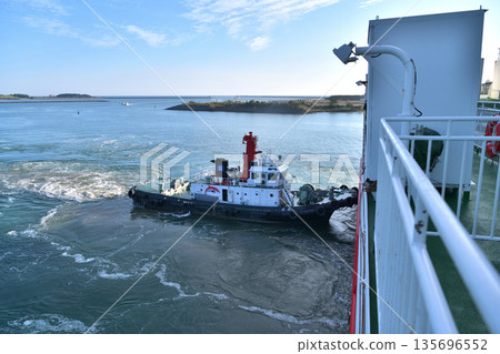 Miyazaki Car Ferry Assisted by Tugboat in Docking 135696552