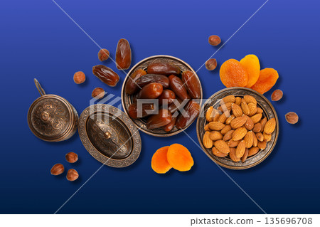 Traditional dried fruits and nuts arranged for Ramadan festivity Traditional dried fruits and nuts arranged for Ramadan festivity 135696708