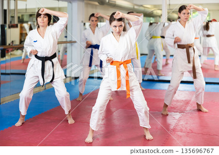 Women in a white kimono in training on a map 135696767