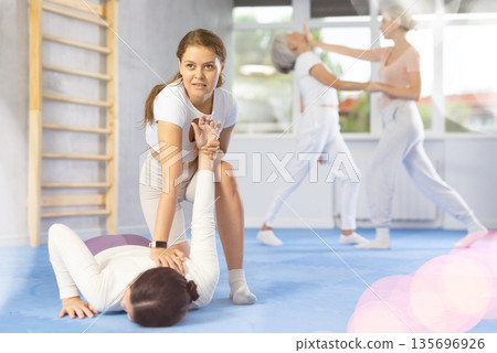 Two young women training self-defense techniques Two young women training self-defense techniques 135696926