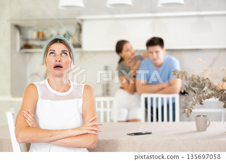 Furious guy and girl screaming to mother 135697058