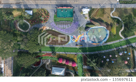 Aerial view of a picturesque botanical garden situated along the Kok River in Chiang Rai, Thailand. Aerial view of a picturesque botanical garden situated along the Kok River in Chiang Rai, Thailand. 135697611