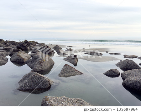 Stunning view at beach with coastal rocks and clear ocean water 135697964