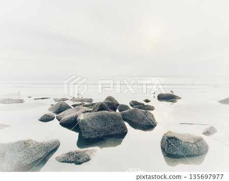 Stunning view at beach with coastal rocks and clear ocean water 135697977