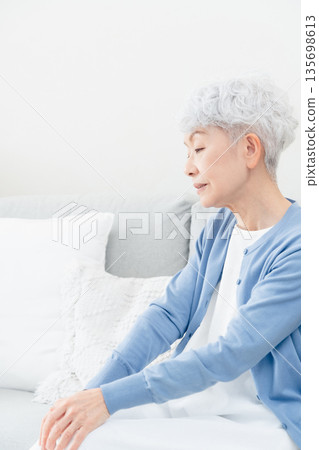 Depressed senior woman 135698613