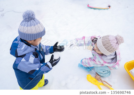 Children playing in the snow 135698746