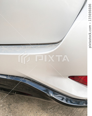 Dented and scratched the rear bumper of a silver SUV. Dented and scratched the rear bumper of a silver SUV. 135698886