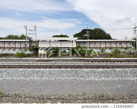 Worker accommodation container near railway tracks. Worker accommodation container near railway tracks. 135698887
