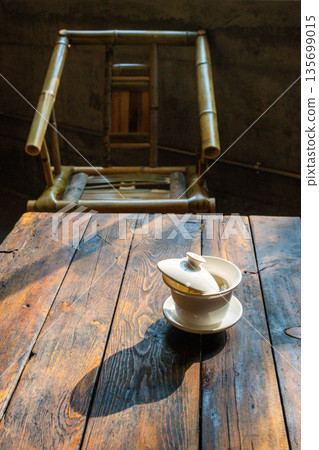 Tea set on wooden table in Chengdu cafe during afternoon sunlight Tea set on wooden table in Chengdu cafe during afternoon sunlight 135699015
