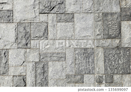 Rough Gray Granite Stone Wall Texture and Background. Rough Gray Granite Stone Wall Texture and Background. 135699097