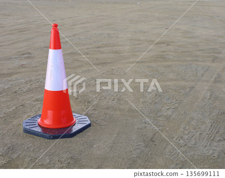 Traffic Cone on Road Surface Traffic Cone on Road Surface 135699111