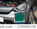 Image of replacing a car battery 135699136