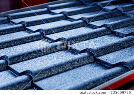 Blue metallic roof tiles background with drops of water. Blue metallic roof tiles background with drops of water. 135699759