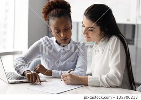 Woman signing contract, accepting new job offer, approving business deal 135700218