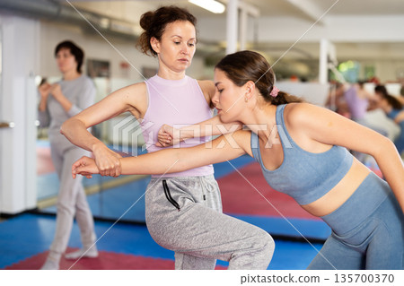 Women practicing gifts in self-defense training Women practicing gifts in self-defense training 135700370