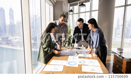 Marketing agency staff analyzing research results, reviewing reports Marketing agency staff analyzing research results, reviewing reports 135700699