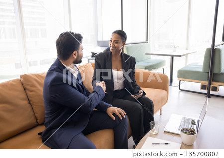 Young businessman shake hand of female consultant grateful for assistance Young businessman shake hand of female consultant grateful for assistance 135700802