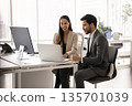 Young professional woman conduct meeting with male client 135701039