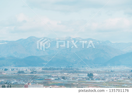 Tendo city with Sakura Cherry Blossom and snow mountain in Spring season, view from Tendo Park or Maizuru Park. Yamagata prefecture, Tohoku, Japan, 21 April 2025 135701176