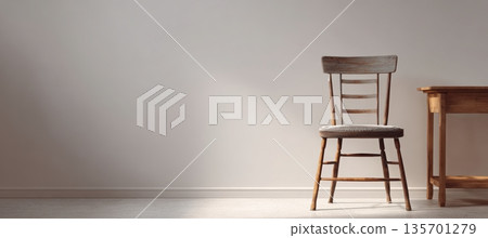 Empty Wooden Chair Beside Table in Bright Minimalist Room 135701279