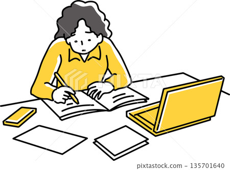 A woman working with a computer in front of her 135701640