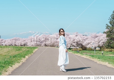 Woman tourist sightseeing Kitakami Tenshochi Park with Sakura Cherry Blossom in Spring, traveler travel in Kitakami festival, Iwate prefecture, Japan. Landmark for Travel and Vacation destination Woman tourist sightseeing Kitakami Tenshochi Park with Sakura Cherry Blossom in Spring, traveler travel in Kitakami festival, Iwate prefecture, Japan. Landmark for Travel and Vacation destination 135702233