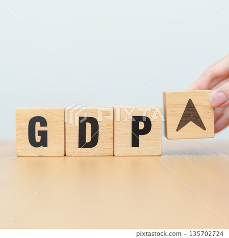 wooden block of GDP text to UP and Down arrow symbol icon. Gross domestic product, Financial, Management, Economic growth, consumption, investment, government purchases and net exports 135702724