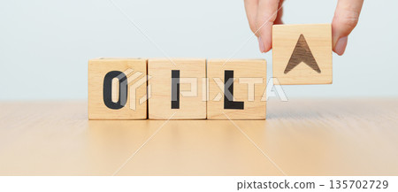 Hand change wooden block with OIL text to UP and Down arrow symbol icon. Trade war, stocks, financial, cut loss and economic concept 135702729