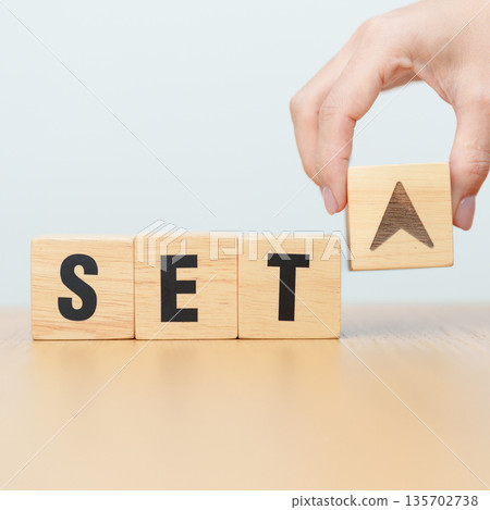 Hand change wooden block with SET text or The Stock Exchange of Thailand to UP and Down arrow symbol icon. decrease and increase, price, stocks, financial, trade, value and Cut loss concept 135702738