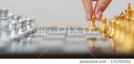 hand moving gold Chess King figure and Checkmate opponent during chessboard competition. Strategy, Success, management, business planning, win, disruption, Trade war and leadership concept hand moving gold Chess King figure and Checkmate opponent during chessboard competition. Strategy, Success, management, business planning, win, disruption, Trade war and leadership concept 135702802