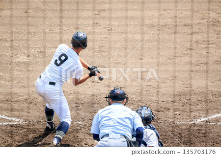 High school baseball behind the backstop 135703176