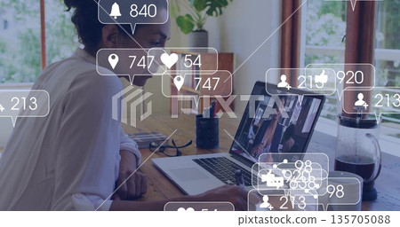 Woman wearing white shirt writing in notebook in home office, with laptop, eyeglasses, copy space Woman wearing white shirt writing in notebook in home office, with laptop, eyeglasses, copy space 135705088