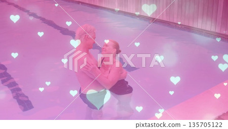 Gazing senior couple wearing swimwear and embracing in pool, with lane markings and heart graphics Gazing senior couple wearing swimwear and embracing in pool, with lane markings and heart graphics 135705122