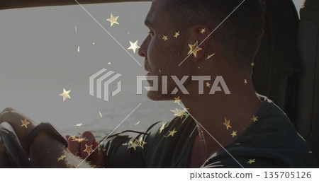 Gripping steering wheel, man gazing toward ocean in car, with headrest, golden star confetti Gripping steering wheel, man gazing toward ocean in car, with headrest, golden star confetti 135705126