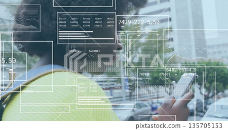 Woman wearing chartreuse top using digital overlays while holding phone on city street, copy space 135705153