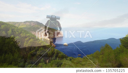 Standing male hiker surveying rocky outcrop overlooking blue bay, with green backpack, sleeping mat Standing male hiker surveying rocky outcrop overlooking blue bay, with green backpack, sleeping mat 135705225