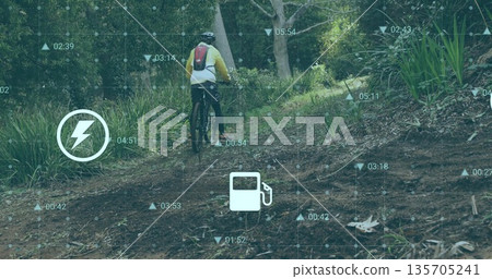 Pedaling mountain biker uphill forest trail with yellow jacket, helmet, bike and HUD overlay Pedaling mountain biker uphill forest trail with yellow jacket, helmet, bike and HUD overlay 135705241