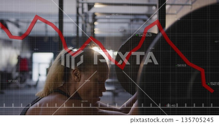 Bracing woman in sports top gripping loaded barbell under rack in gym, with grid graph overlay 135705245
