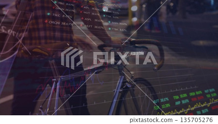 Walking mid-adult man pushing fixed-gear bicycle on wet street at night with stock chart overlays Walking mid-adult man pushing fixed-gear bicycle on wet street at night with stock chart overlays 135705276