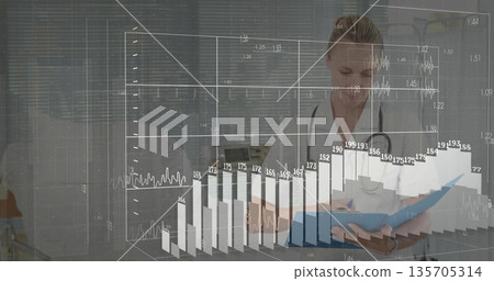 Doctor wearing lab coat reviewing patient report and data charts at medical desk, copy space Doctor wearing lab coat reviewing patient report and data charts at medical desk, copy space 135705314