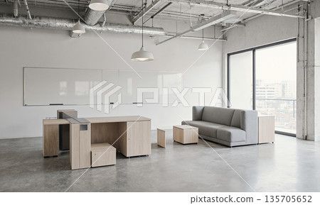 Empty Creative Incubator. A modern incubator space with modular, reconfigurable furniture pieces separated in a large, open room. Whiteboards are 135705652