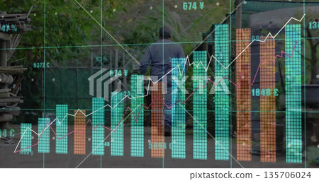 Walking senior man navigating yard path, with financial charts, wooden planks and containers 135706024