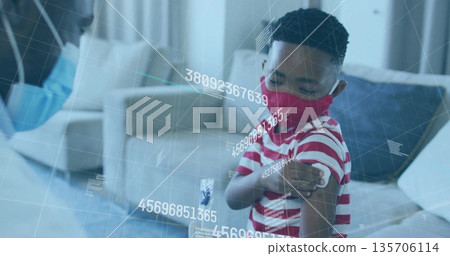 Administering vaccine healthcare worker in scrubs leaning over home sofa with syringe data overlay Administering vaccine healthcare worker in scrubs leaning over home sofa with syringe data overlay 135706114