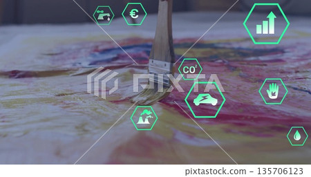 Paintbrush with wood handle applying red paint on canvas in art studio, with green hexagon icons Paintbrush with wood handle applying red paint on canvas in art studio, with green hexagon icons 135706123