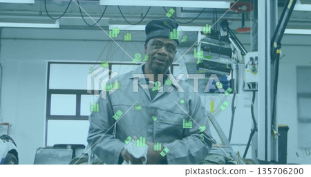 Cleaning mechanic in grey coveralls, black cap wiping engine bay workshop, with floating data icons Cleaning mechanic in grey coveralls, black cap wiping engine bay workshop, with floating data icons 135706200