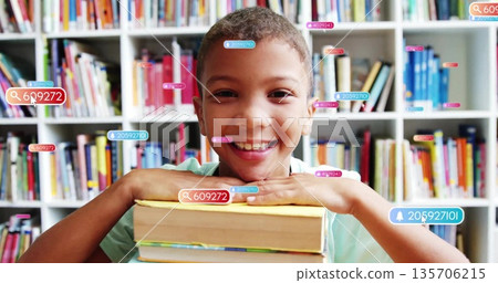 Resting boy wearing light green shirt leaning on book stack in library, with digital label overlays Resting boy wearing light green shirt leaning on book stack in library, with digital label overlays 135706215