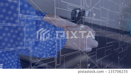 Hand clad in blue polka dot shirt turning faucet handle at kitchen sink, with AR overlays 135706235