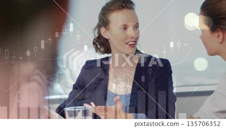 Female in navy blazer speaking and gesturing in conference room, with financial chart overlays Female in navy blazer speaking and gesturing in conference room, with financial chart overlays 135706352
