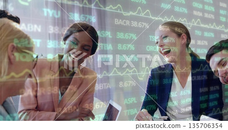 Analyzing financial data, team wearing business attire using laptop at meeting table, stock overlay Analyzing financial data, team wearing business attire using laptop at meeting table, stock overlay 135706354